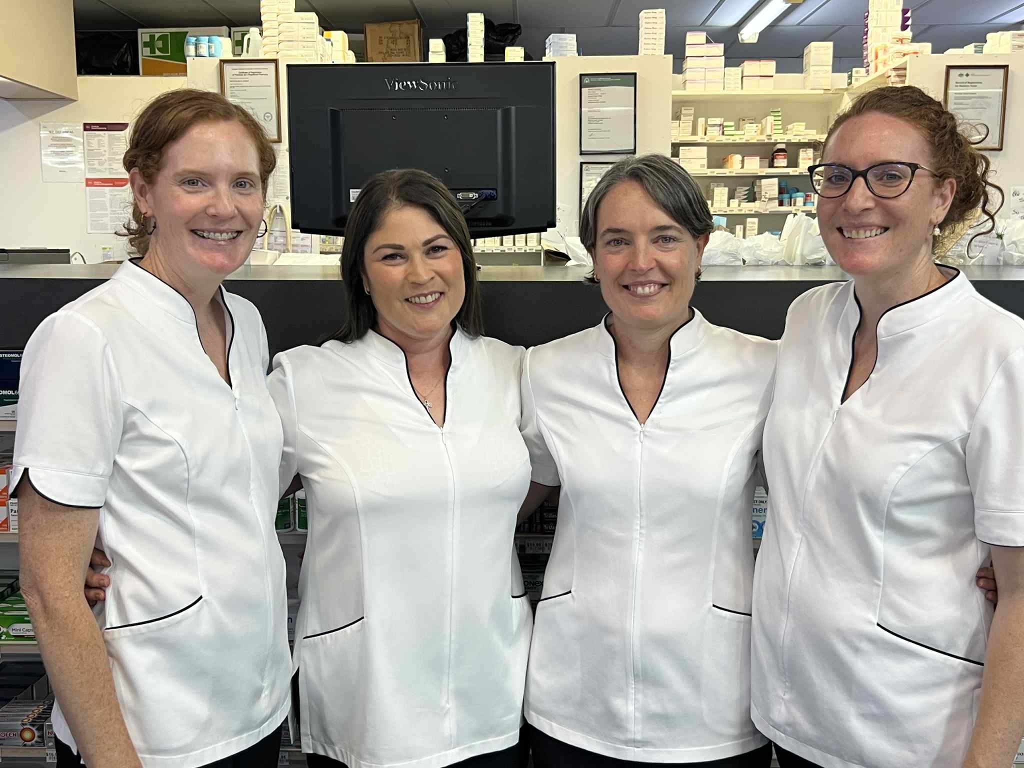 The Narrogin Pharmacy team smiling inside the pharmacy